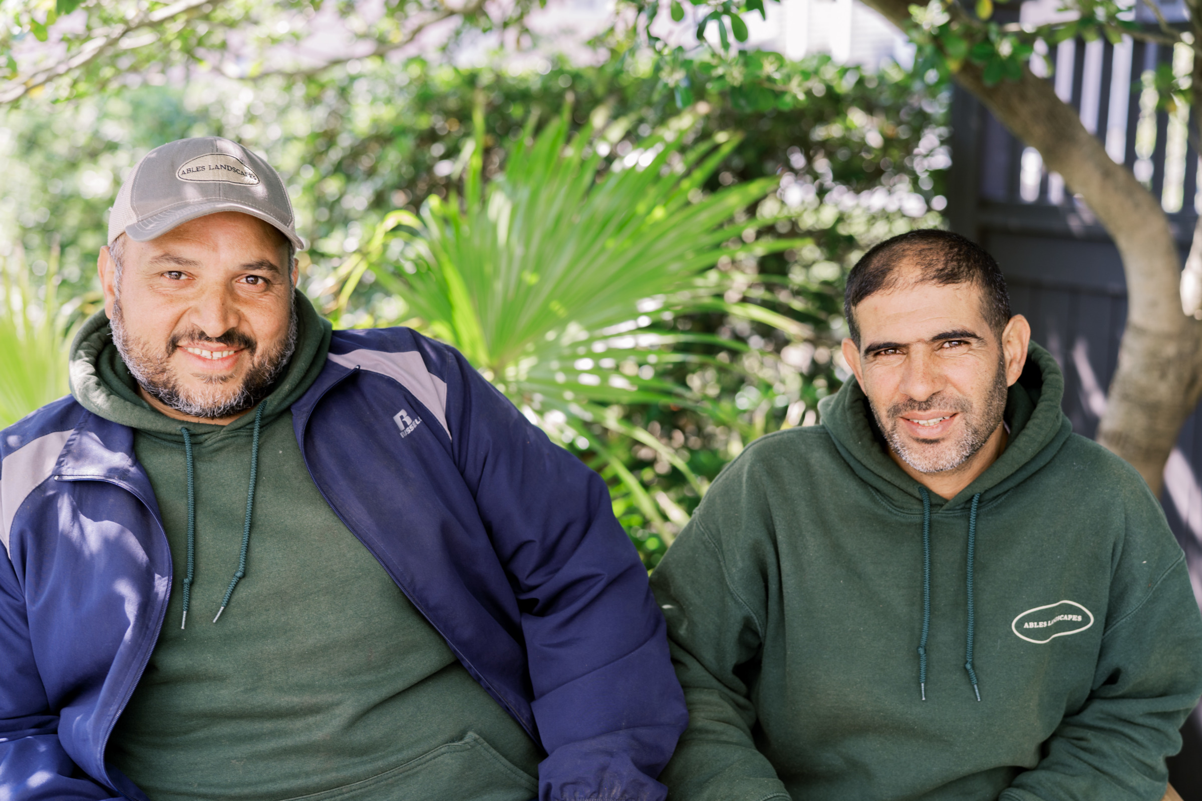 Two asylum-seekers smiling.